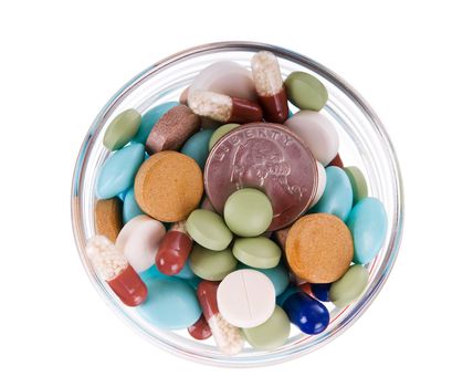 Fifty cents in glass saucer full of different pills on white background