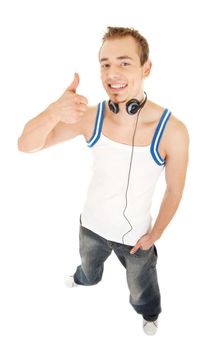 Smiling handsome young man in casual style with headphones shows sign good, isolated on white background