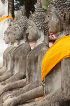 Buddha statue at Wat Yai Chai Mongkol in a row Ayutthaya