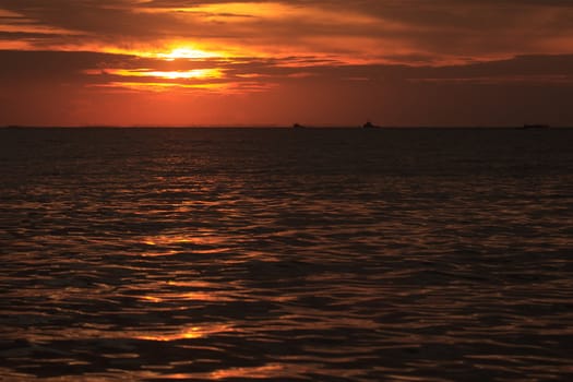 sea against golden sky on sunset