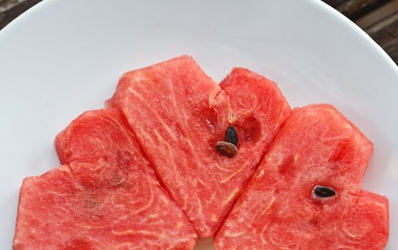 Heart shaped watermelon in a white dish