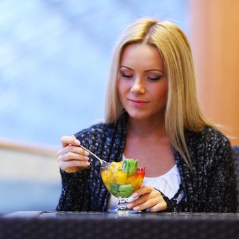 woman eat desert in caffe