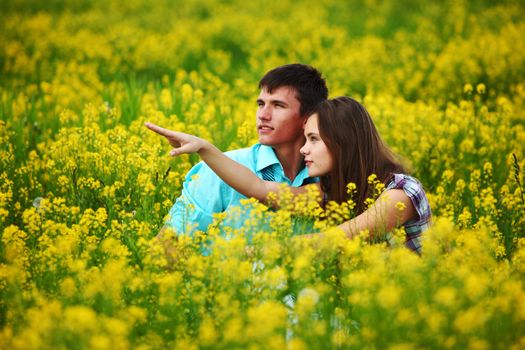 lovers hug on yellow flower field