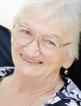 Close up image of a senior woman laughing