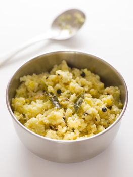 close up of a bowl of indian pongal