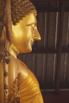 The golden statue of Buddha Wat Yai Chai Mongkol in Ayutthaya