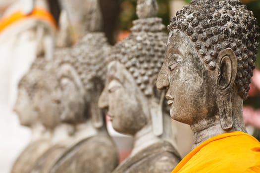 Statues of Buddha in a row Wat Yai Chai Mongkol, Ayutthaya in Thailand