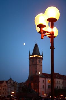 Luminous street lamp on background with Town Hall Tower,Prague,Czech Republic