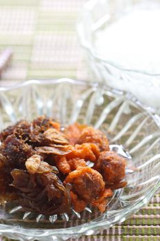 rice in cold water served with fried sweet pork and vegetable