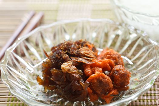 rice in cold water served with fried sweet pork and vegetable