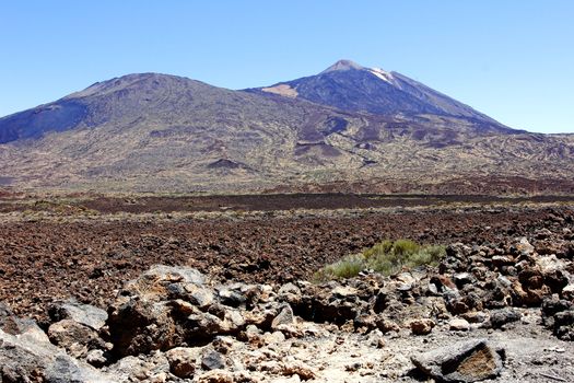 The conical volcano Mount Teide or El Teide in Tenerife is Spains highest mountain. It has featured as the location of many hollywood films and is the premier tourist attraction in the Canary islands