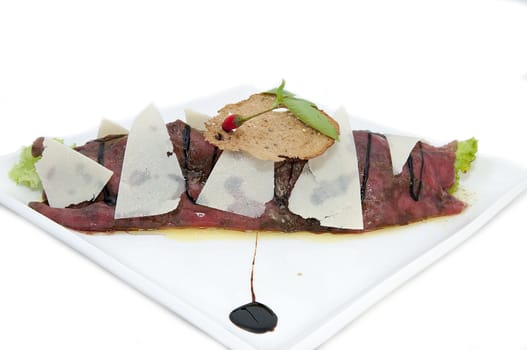 carpaccio at a restaurant on a white background