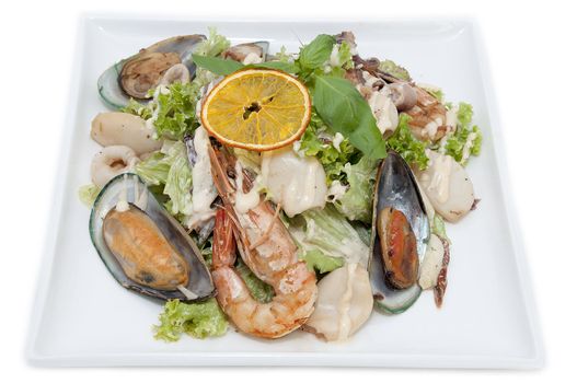 salad with seafood in a restaurant on a white background