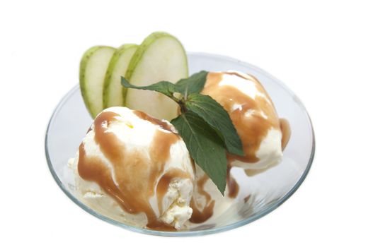 ice cream with caramel sauce and mint on a white background