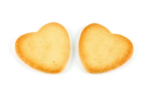 two heart shaped cookies made ​​with natural ingredients on white background