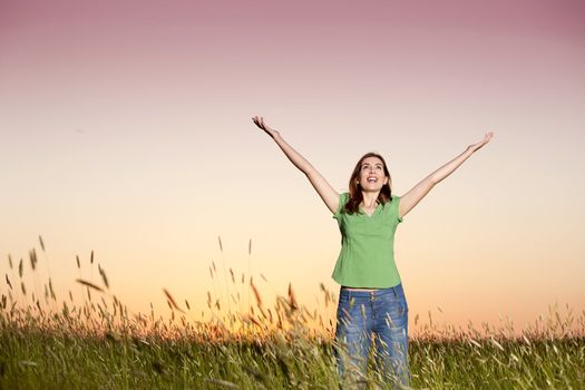 Outdoor portrait of a woman on a meadow releaxing