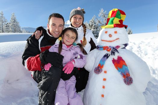 Family with a snowman