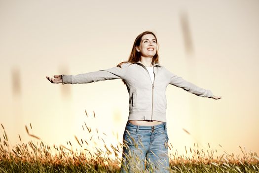 Outdoor portrait of a woman on a meadow releaxing