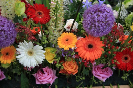 Multicolored floral arrangement with roses and gerberas