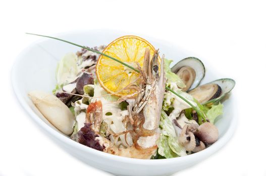 salad with seafood in a restaurant on a white background