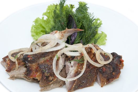 lamb with greens in a restaurant on a white background