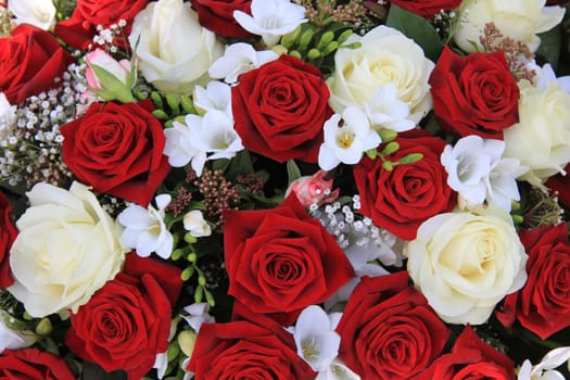 Classic combination of big white and red roses in a bouquet