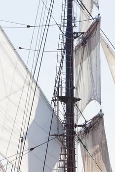 Marine or nautical background of a three masted barquentine yacht with sails and rigging detail