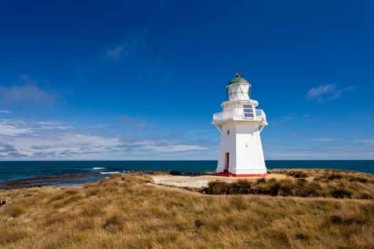 Beautifully restored heritage building of Waipapa Point Lighthouse on The Catlins coast on South Island of New Zealand