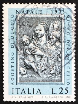 ITALY - CIRCA 1973: a stamp printed in the Italy shows Virgin And Child, Sculpture by Agostino di Duccio, Christmas, circa 1973