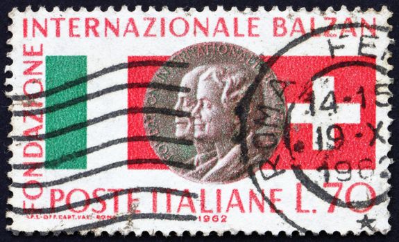 ITALY - CIRCA 1962: a stamp printed in the Italy shows Swiss and Italian Flags, Eugenio and Lina Balzan Medal, 1st Distribution of Balzan Prize for Italian - Swiss Cooperation, circa 1962