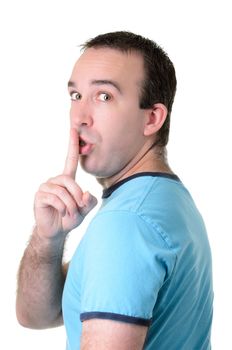 An average guy holding his finger to his lips, isolated against a white background.