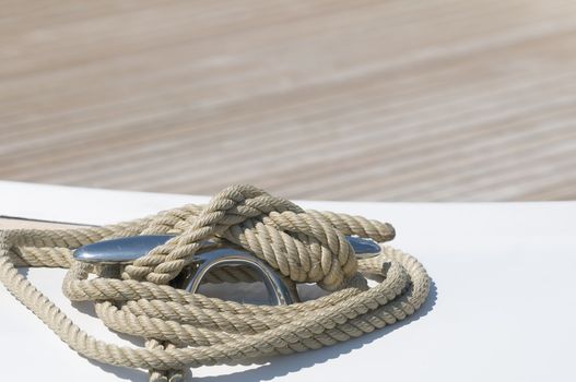 Close-up of rope tied-up on a boat bollard