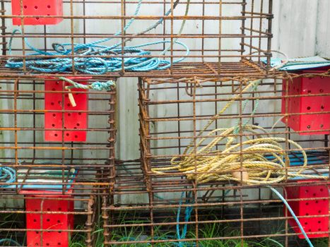 Closeup of stacked lobster basket traps for catching crab and lobster in the ocean