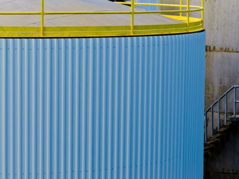 Closeup of large steel storage tank at a refinery terminal used for storage and distribution of petrochemical products