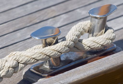 Boat rope tied up on a bitt
