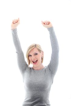 Jubilant young woman raising her arms above her head in celebration of a success isolated on white 