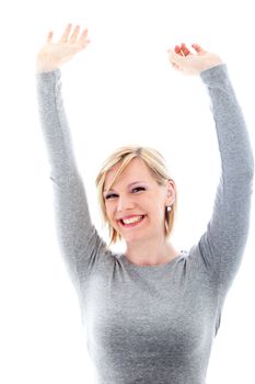 Successful beautiful young woman beaming with pleasure raising her arms above her head in exultation Successful beautiful young woman beaming with pleasure raising her arms abive her head in exultation 