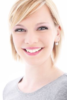 High key portrait of a beautiful blonde woman with a lovely wide smile and laughing eyes isolated on white High key portrait of a beautiful blonde woman with a lovely wide smile and luminous eyes isolated on white 