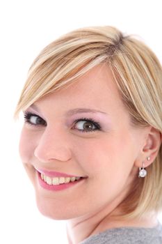 Close up portrait of smiling blonde woman on white background 