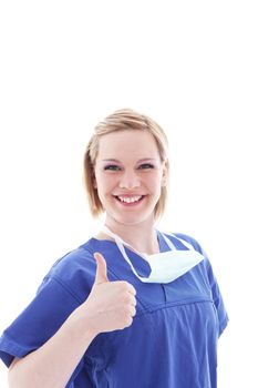 Happy nurse or doctor in blue scrubs giving a thumbs up of hope and praise for a successful outcome Happy nurse or doctor in blue scrubs giving a thumbs up of hope and praise for a success outcome 