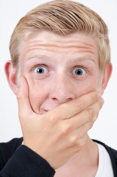 afraid blond victim man with hand covering his mouth