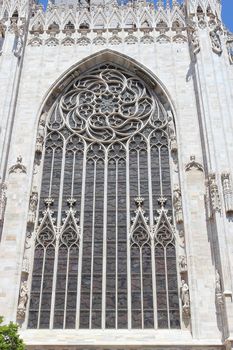The right part of a facade of cathedral Duomo of the Italian city of Milan