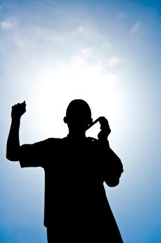 silhouette of boy with medal prize