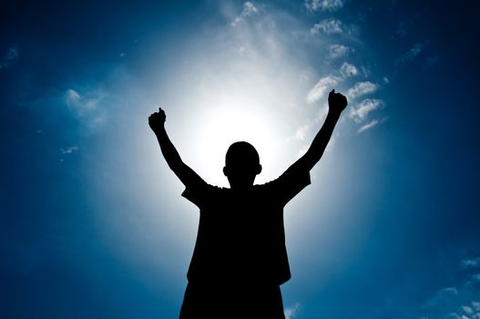 silhouette of boy with medal prize