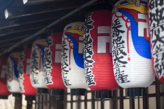 Traditional paper lanterns at a buddhist temple, pictured with a narrow depth of field