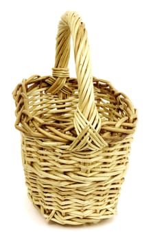 Basket in wattled from willow rods in white background