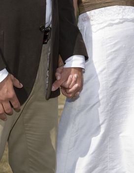 Close up of couple holding hands