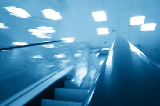 escalator transportation motion blured business background 