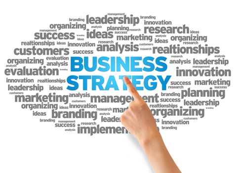 Hand pointing at a Business Strategy Word Cloud on white background.