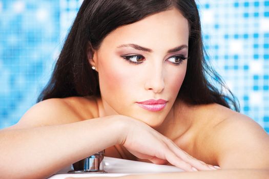 Woman relaxing in spa center